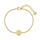 Gold-toned bracelet with a mother-of-pearl disc featuring a Greek key pattern, clear round stones, and a lobster clasp.