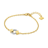Gold-toned chain bracelet with a central silver-toned woven wire loop flanked by two gold-toned cubic blocks with geometric p