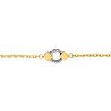 Gold-toned chain bracelet with a silver-toned twisted cable ring centerpiece flanked by two gold-toned square beads with etch