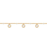 Gold-toned chain bracelet with three round white iridescent charms framed by a patterned border, interspersed with small clea