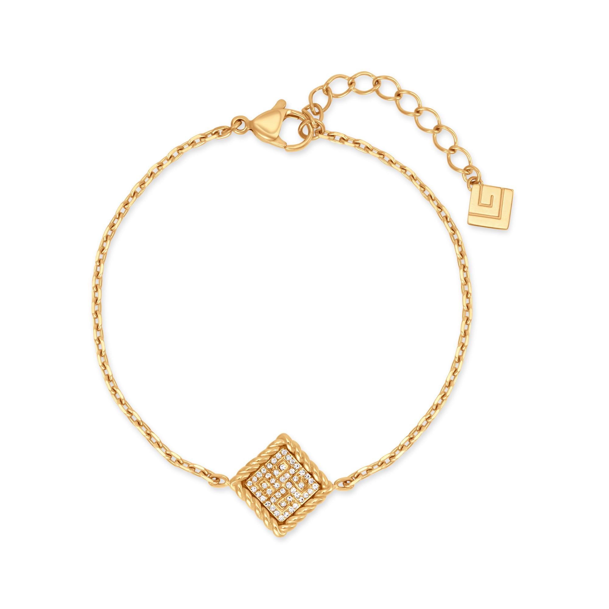 Gold-toned chain bracelet with a diamond-shaped charm featuring a twisted wire border and clear crystals. Lobster clasp and e