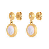 Gold-toned dangle earrings with clear stone studs. Round drops feature iridescent mother-of-pearl inlays and engraved Greek k