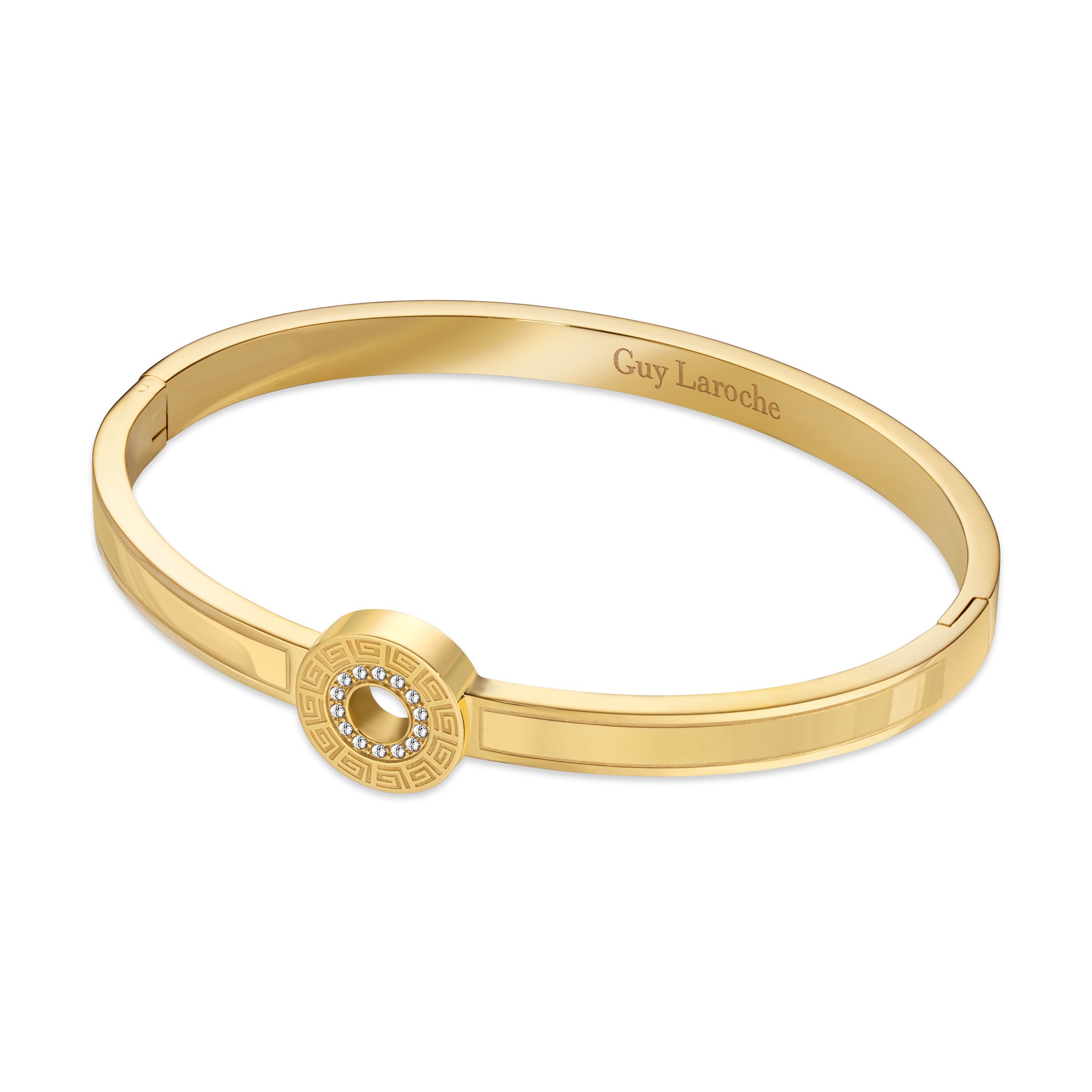 Gold-toned hinged bangle bracelet with a central circular embellishment featuring clear crystals and an engraved pattern.