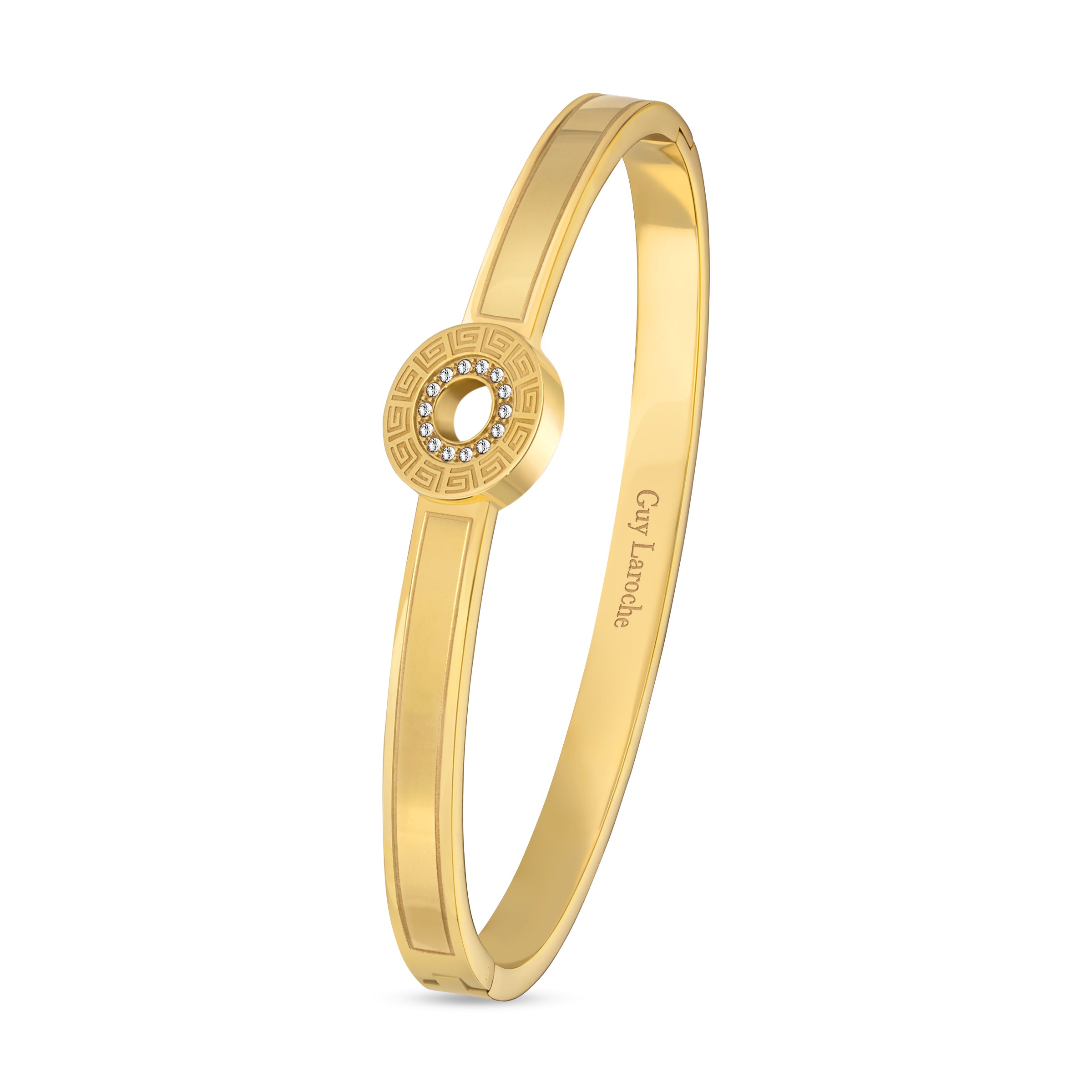 Gold-toned bangle with a central circular motif featuring a Greek key pattern and clear crystals around an open center. Etche