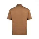 Back of a men's camel short-sleeve cotton knit polo shirt with a ribbed collar.