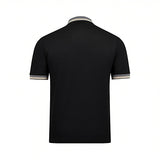 Black short-sleeved polo shirt with ribbed grey, white, and gold-toned striped collar and cuffs.