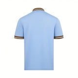 Back of a light blue short-sleeved polo shirt. It has a brown collar and brown sleeve cuffs, each with two thin white stripes