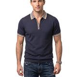 Navy blue knit polo with a grey collar and cuffs, both featuring thin light and dark beige stripes. Silver-toned zipper.