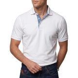 White men's short-sleeved polo shirt with a pointed collar and light blue denim-effect inner placket.