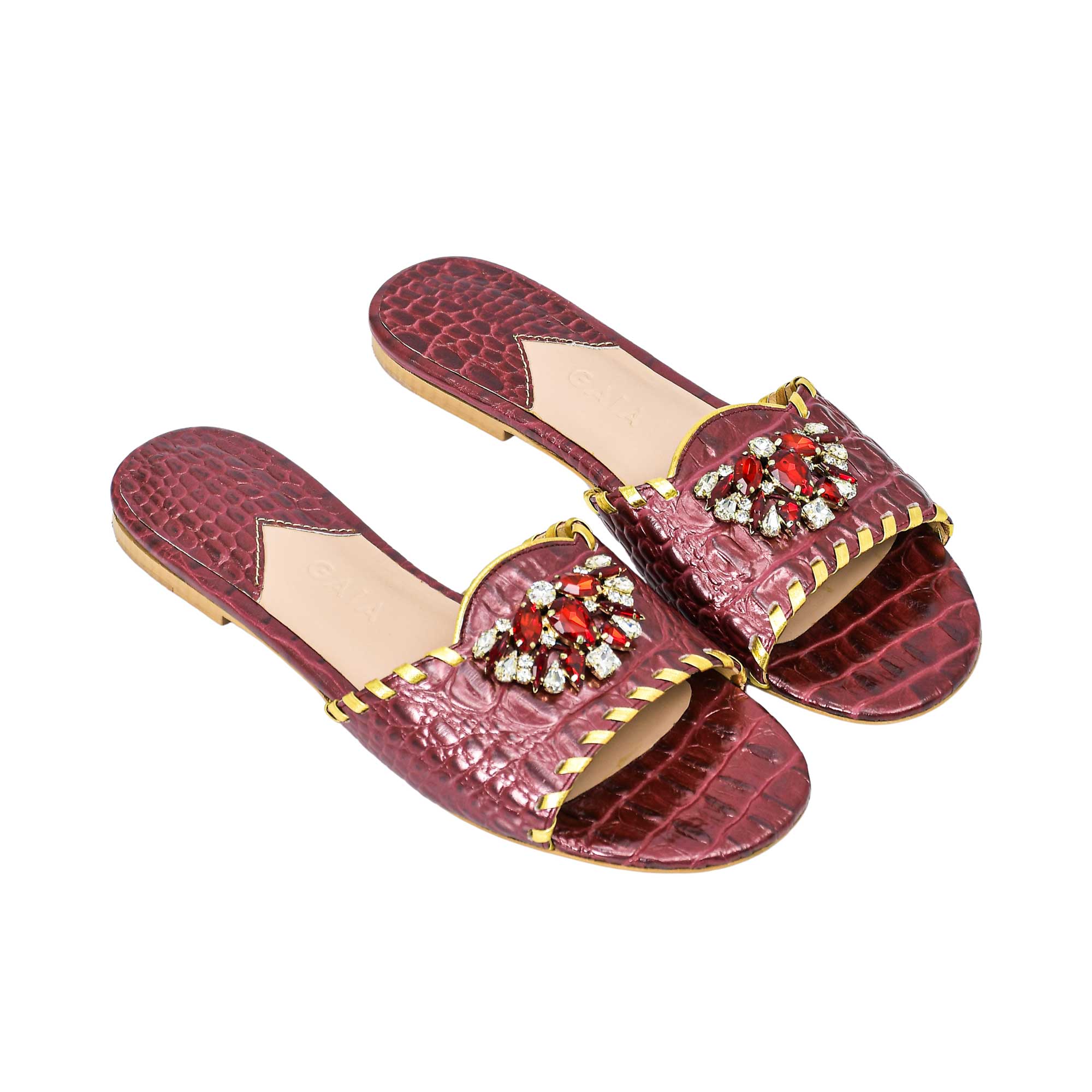 Angled top view of GAIA Maron embellished slip-on sandals highlighting the textured leather design from BLUE SALON.