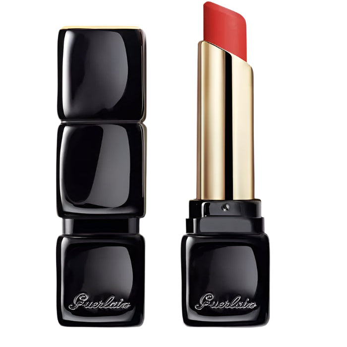 Guerlain Kiss Kiss Lips Tender Matte lipstick in shade 520 Sexy Coral, with the lipstick cap off, showing the product in a sleek black and gold packaging.