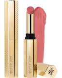 Guerlain KissKiss Honey-Infused Matte Lipstick in its signature slim golden honeycomb case, alongside an open vivid raspberry-pink lipstick bullet and smooth texture smudge, available at blue salon.