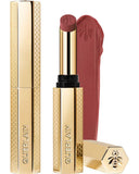 Guerlain KissKiss Honey-Infused Matte Lipstick in its signature slim golden honeycomb tube, featuring an open deep plum-berry lipstick bullet next to a velvety color smudge, available at blue salon.