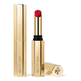Guerlain KissKiss Honey-Infused Matte Lipstick in its signature slim golden honeycomb case, standing next to an open bright crimson-red lipstick bullet and its detached cap, available at blue salon.