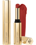 Guerlain KissKiss Honey-Infused Intense Lipstick in its slim, refillable golden honeycomb case, shown next to a rich red lipstick bullet and texture smudge, available at blue salon.
