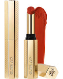 Guerlain Rouge G Honey-Infused Matte Lipstick in its signature slim golden honeycomb case, alongside an open bullet and a vibrant orange-red creamy texture smudge, from blue salon.