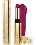 Guerlain KissKiss Honey-Infused Matte Lipstick in its signature slim golden honeycomb tube, featuring an open deep plum-berry lipstick bullet next to a velvety color smudge, available at blue salon.