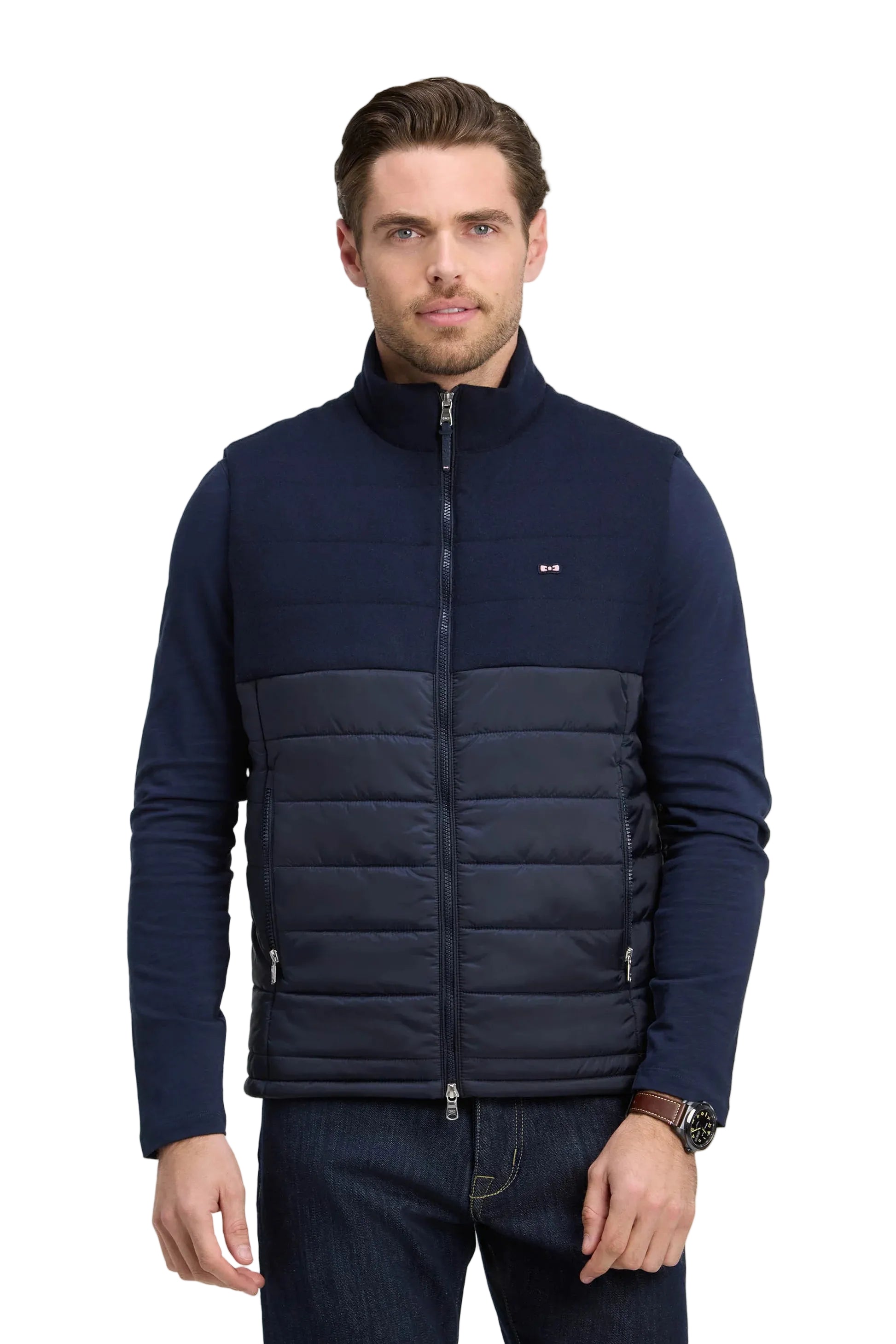 Dark blue men's hybrid vest with a padded, horizontally quilted front, knitted long sleeves and back, stand collar, and full