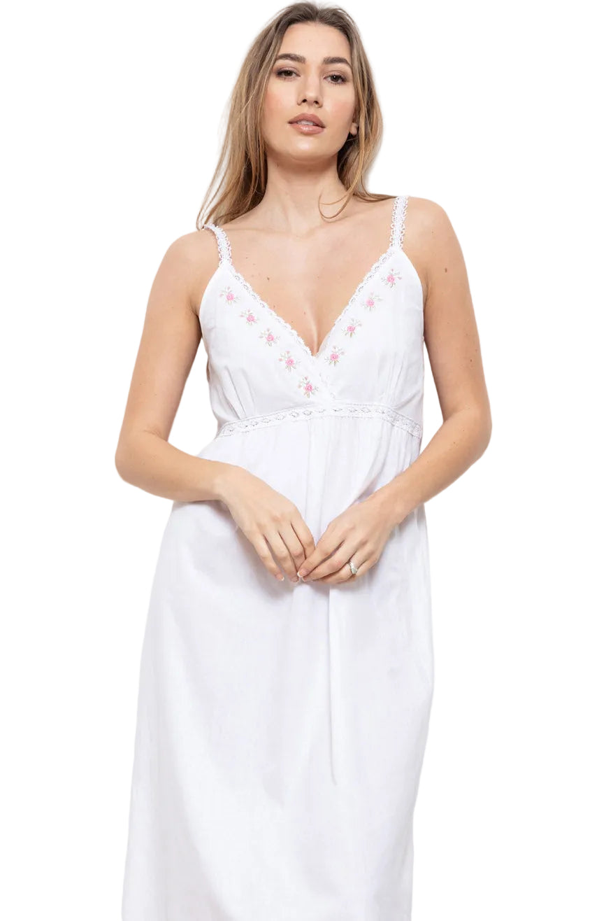 White strappy nightdress with V-neckline, delicate lace trim, empire waist, and pink rose embroidery on the bust.