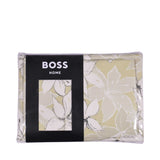Jadeite duvet cover, flat sheet, and pillowcases with a light green background and large white floral patterns outlined in da