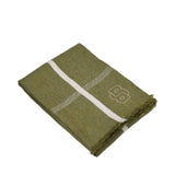 Folded jadeite green throw with white intersecting stripes, a subtle herringbone pattern, an embroidered 'BB' logo, and fring