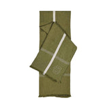 Jadeite green woven throw with a white vertical stripe, grid pattern, and a white outline 'B' logo. Fringed ends.