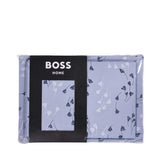 Periwinkle duvet cover and pillow case set with white and navy stylized floral patterns.