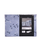 Light blue duvet cover and pillow case set with a repeating pattern of white and dark blue stylized leaves.