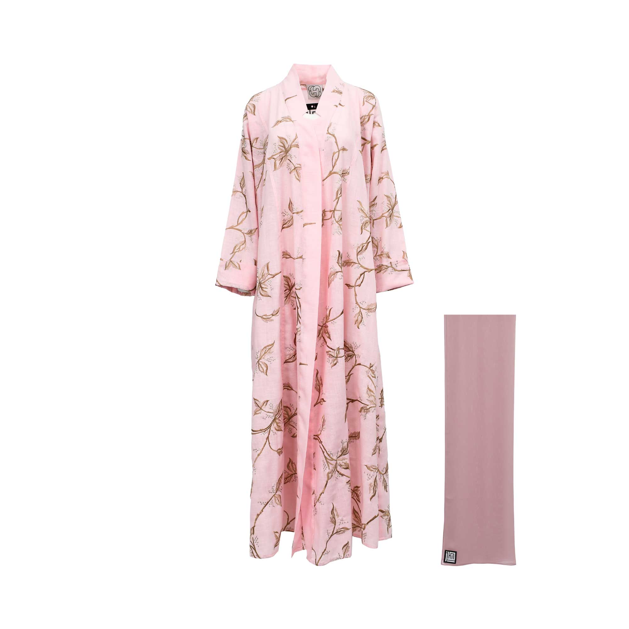Hayas Boutique light pink linen open abaya with intricate gold floral vine embroidery, shown in a front view with a coordinating dusty rose hijab, isolated on a white background."