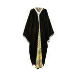 Front view of a deep olive velvet kaftan abaya featuring a lime green floral print inlay and white lace embroidery.