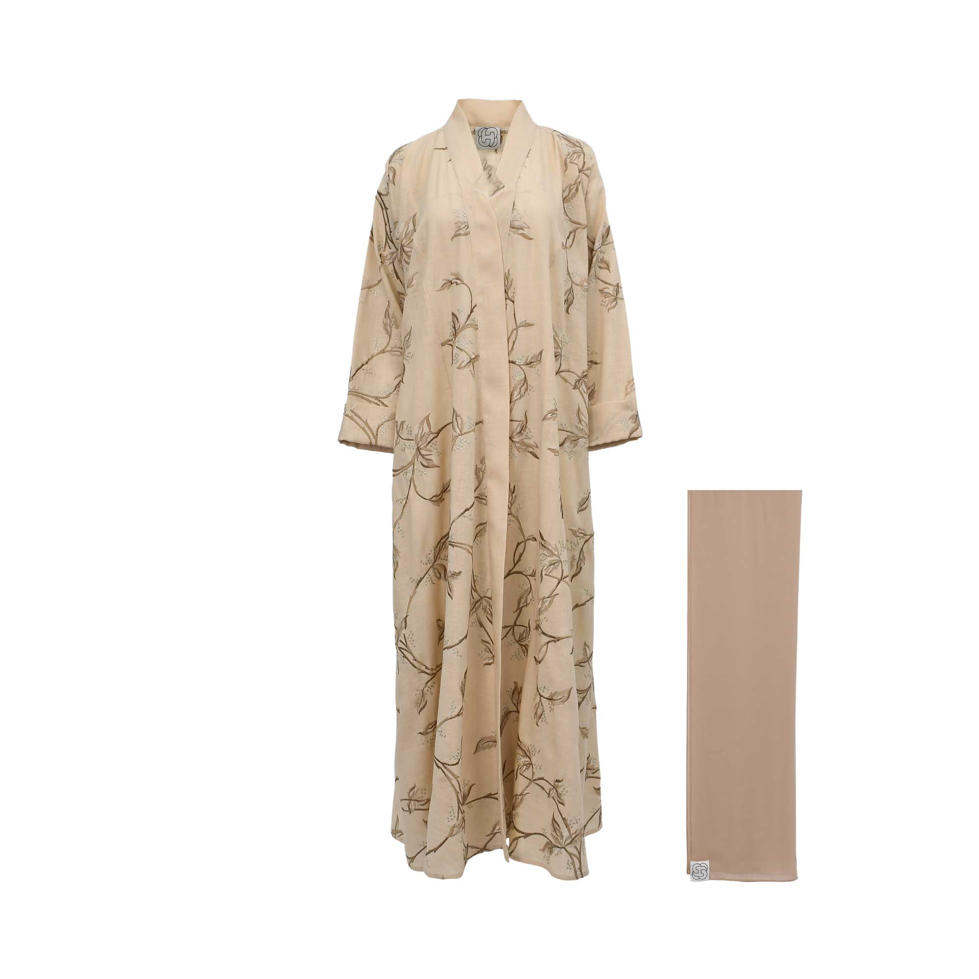 Front view of a sand beige linen abaya featuring intricate olive-toned leaf embroidery and a matching chiffon sheila.