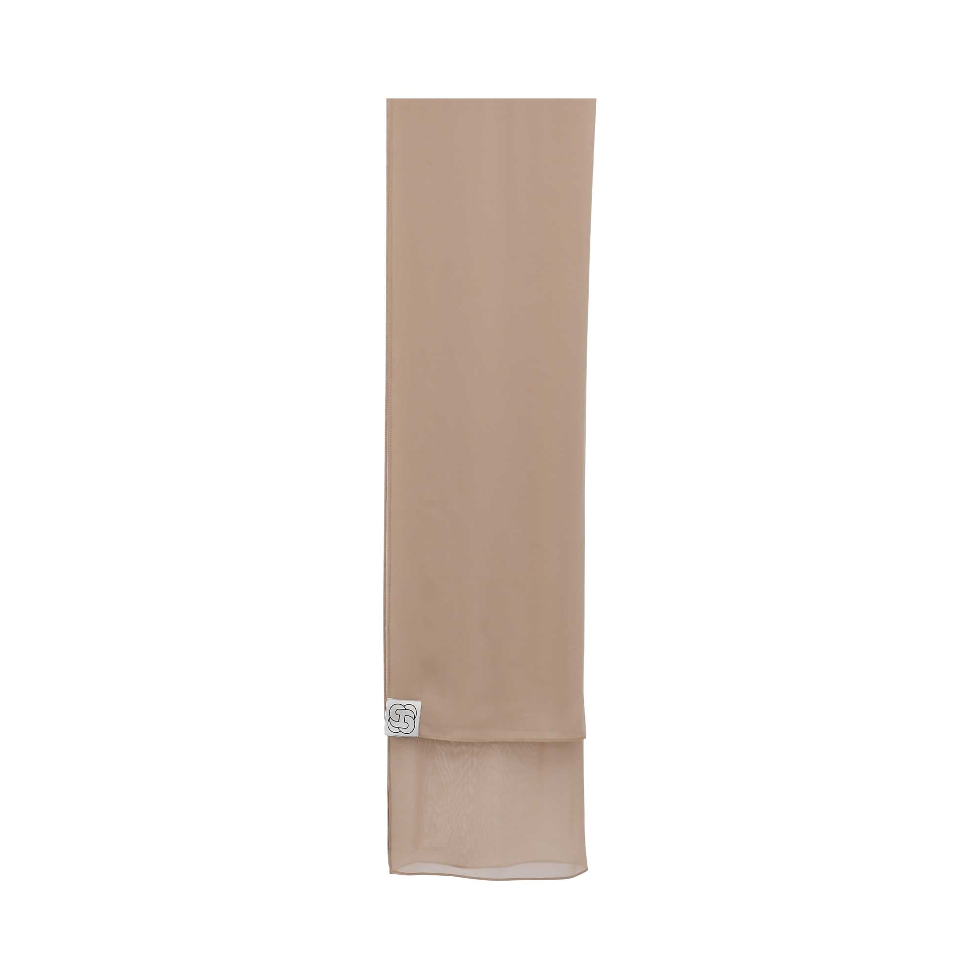 Close-up of the matching sand beige chiffon sheila featuring the square HYS brand logo.