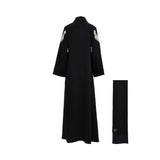 Back view of the pleated abaya showing the continuous marble print transition and high collar.