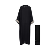 Back view of the navy blue abaya showing the flowing butterfly silhouette and wide-cut sleeves.