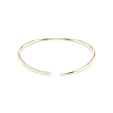 A high-resolution studio view of the Swarovski Mesmera open-front choker necklace, showcasing the asymmetrical design with mixed-cut white crystals lining one side of the 18K gold-finish torque band.
