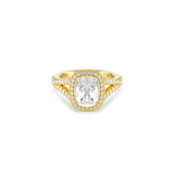 A high-resolution top-down studio view of the Swarovski Una Angelic cocktail ring, showcasing the symmetry of the large, white cushion-cut central crystal framed in a pavé halo, with intricate rows of miniature crystals stretching down the split-shank 18K gold-plated band.