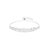 A high-resolution direct frontal studio shot of the Swarovski Mesmera bracelet laid out symmetrically, displaying its clustered bar of clear marquise crystals and its adjustable silver-tone sliding closure.