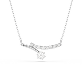 A high-resolution front studio view of the Swarovski Matrix curved pendant, highlighting the elegant sweep of round-cut white crystals and the polished rhodium-plated drop detail on a silver-tone chain.