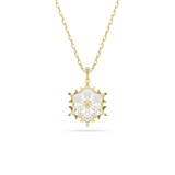 A high-resolution front studio view of the Swarovski Magic pendant, highlighting the geometric, mixed cuts of the white crystals forming a detailed snowflake in a warm, polished 18K gold-plated setting.