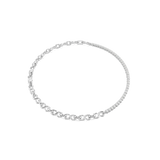 A high-resolution overhead studio view of the Swarovski Matrix necklace laid out in a perfect circle, highlighting the striking contrast between the crystal-set half and the sleek, polished rhodium-plated S-link chain.