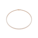 A high-resolution overhead studio view of the Swarovski Matrix tennis necklace arranged in a perfect circle, showcasing the continuous line of round-cut white crystals set in 18K rose gold plating.