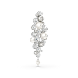 A high-angle studio laydown view of the Swarovski Constella brooch, showcasing how the brilliant round-cut clear crystals catch the light and contrast against the satin luster of the white and silver pearls.