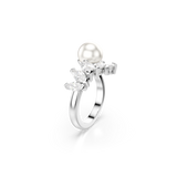 A high-angle side view of the Swarovski Mesmera open ring, capturing the brilliant fire and clarity within the faceted marquise cut stones as the rhodium-plated band sweeps upward toward the smooth, reflective crystal pearl.