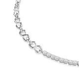 A close-up studio shot detailing the center connection point of the Swarovski Matrix necklace, where the continuous prong-set round white crystals meet the highly polished rhodium-finish S-shape links.