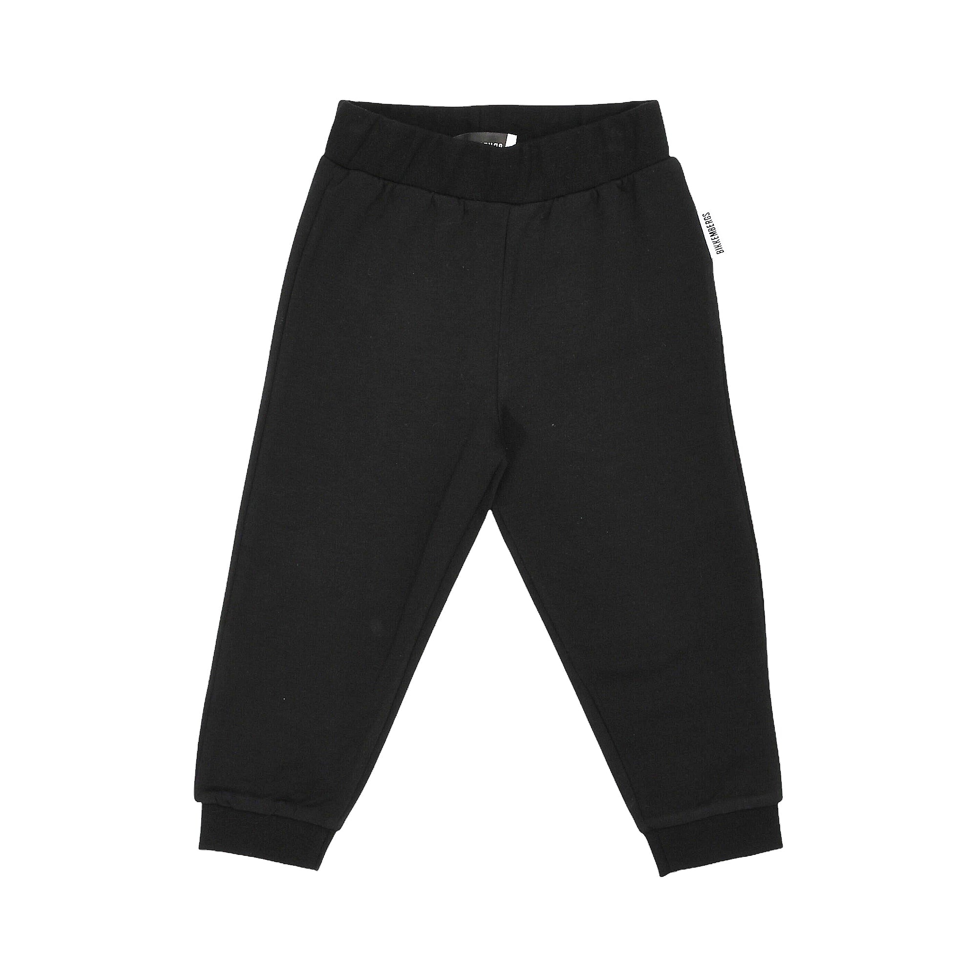 Black jogging bottoms with elasticated waistband and ribbed ankle cuffs. White 'BIRKENKIDS' tag on right waistband.