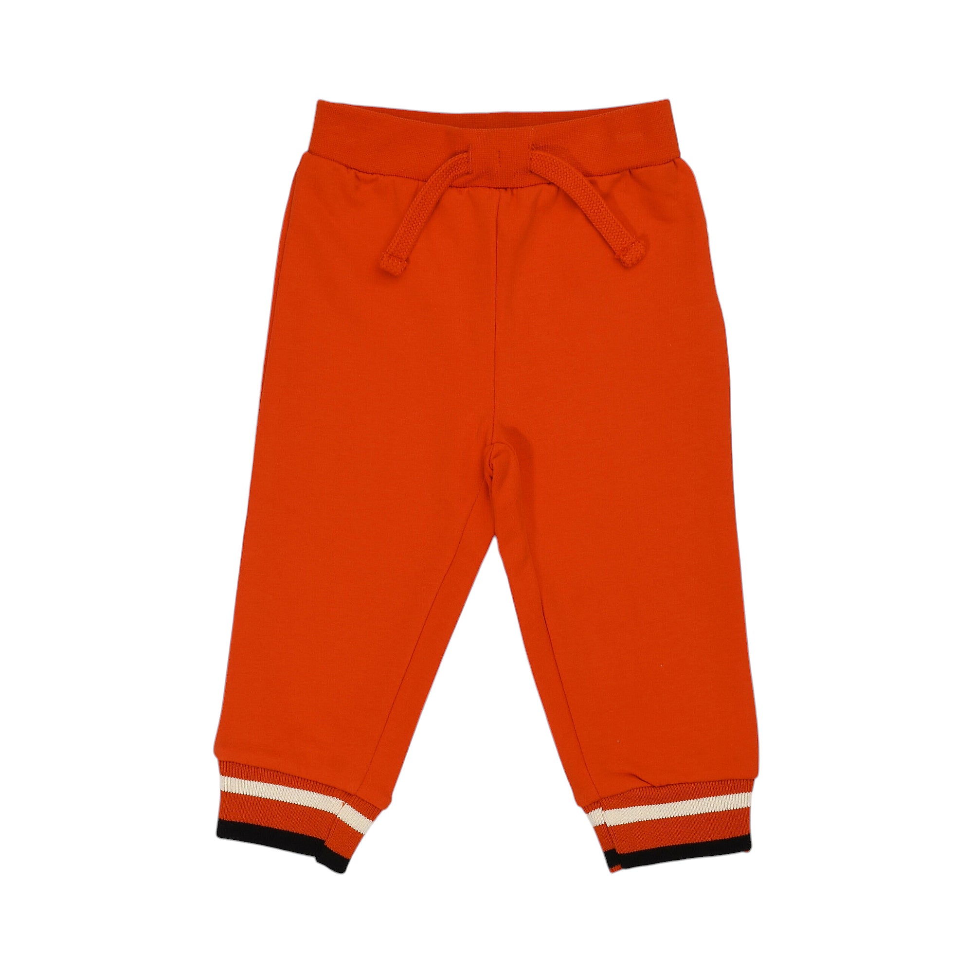 Orange-red jogging pants with an elastic drawstring waist and ribbed cuffs featuring black and white stripes.