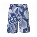 Blue shorts with an all-over white abstract halftone pattern, including letters, and an elastic drawstring waist.