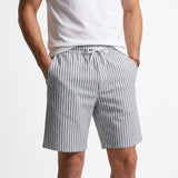 Light blue and off-white striped relaxed-fit shorts with side pockets and a white drawstring waistband