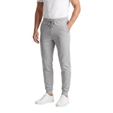 Grey melange men's jogger trousers with an elasticated drawstring waistband, side pockets, knee panel stitching, and ribbed c