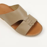 Taupe leather slide sandal with a wide upper strap, cut-out sides, and a small "FARES" embossed tab. Brown insole with stitch